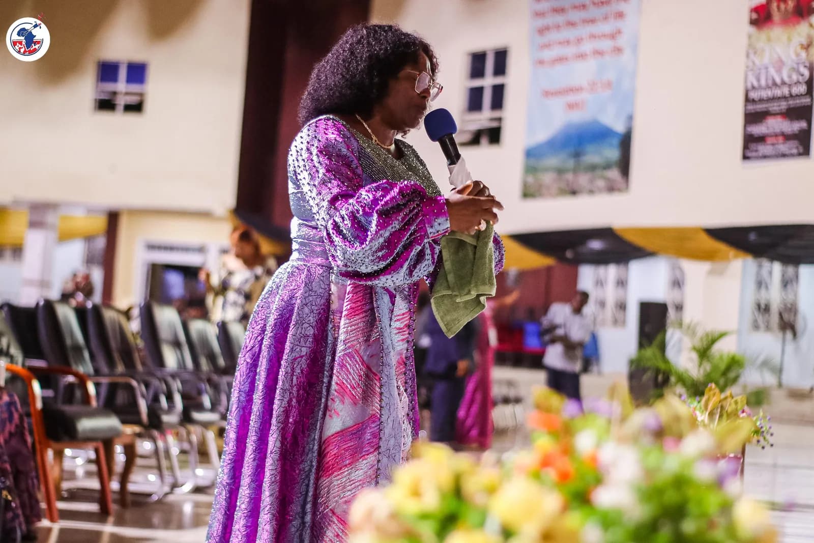 Pastor Martha Kure in prayer during the WIGPA 25th anniversary.